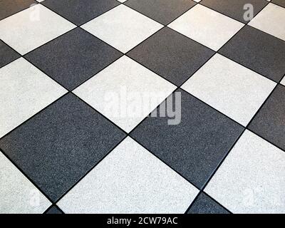 Top view about view Black and white bricks checkered ground or floor mosaic as background for design.Black and white walkway checkered pavement floor Stock Photo