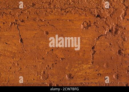 Traditional moroccan terracotta colored background. Orange or ocher clay wall texture. Painted shabby concrete. Stock Photo
