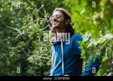 A young man enjoying a hike in Lake Placid, NY Stock Photo