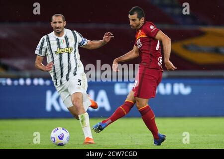 Giorgio Chiellini of Juventus (L) and Henrik Mkhitaryan of Roma (R) in action during the Italian championship Serie A football match between AS Roma a Stock Photo