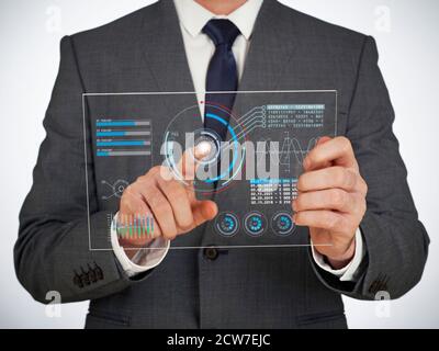 Businessman using a digital virtual touch screen Stock Photo
