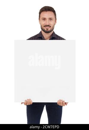 Man with blank sign looking at camera, white background Stock Photo