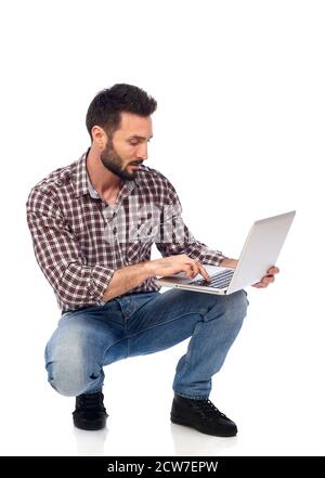 Carpenter working on laptop Stock Photo