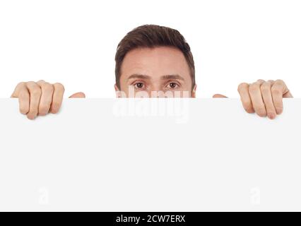 Man with blank sign looking at camera, white background Stock Photo