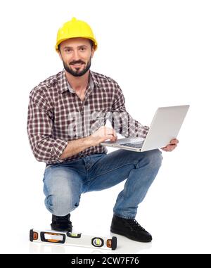 Carpenter working on laptop, white background Stock Photo