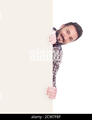 Cheerful handyman holding a blank board, white background Stock Photo