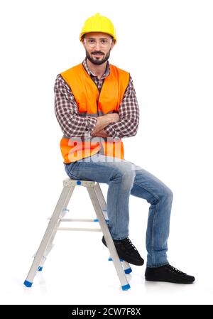 Carpenter sitting on a ladder and looking at camera, white background Stock Photo