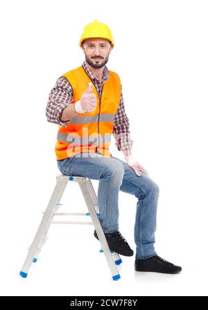 Carpenter sitting on a ladder and looking at camera, white background Stock Photo