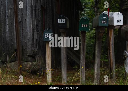 A row of mailboxes on the side of the road Stock Photo