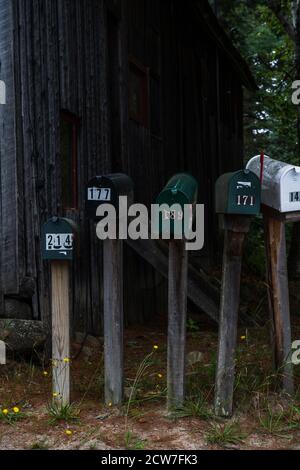 A row of mailboxes on the side of the road Stock Photo