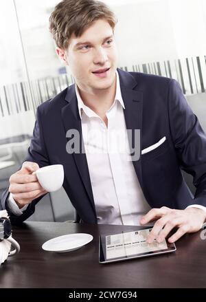 Businessman working on a digital tablet Stock Photo