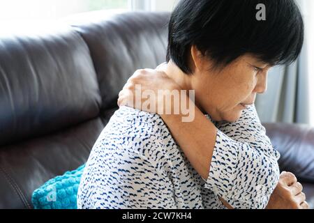 old woman suffering from neck pain, closeup, health problem concept Stock Photo