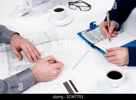 People working on blueprints Stock Photo