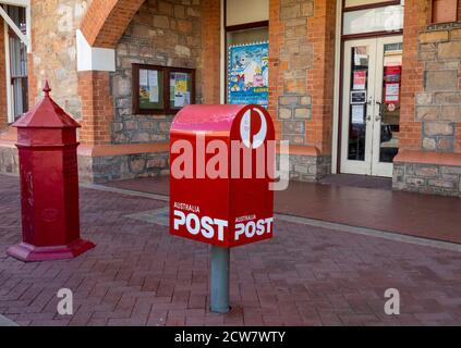 Australia Post modern and traditional red mailboxes in front of York Post Office on Avon Terrace York Western Australia. Stock Photo