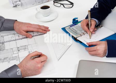 People working on blueprints Stock Photo
