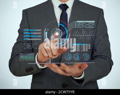 Businessman using a digital virtual touch screen Stock Photo