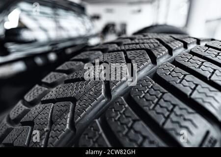 New car tyre photo in car salon Stock Photo