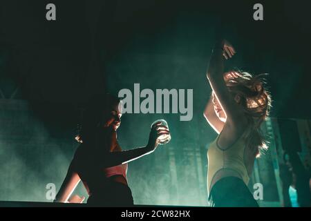 Young girls dancing at nightclub Stock Photo