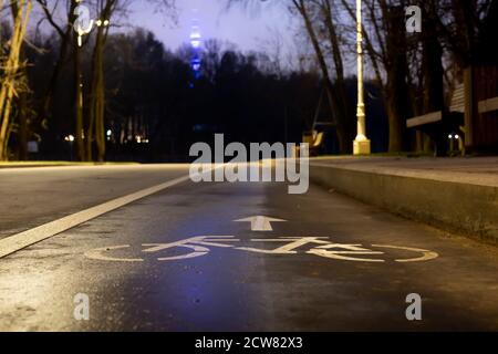 Sign bicycle path. At night in the park Stock Photo