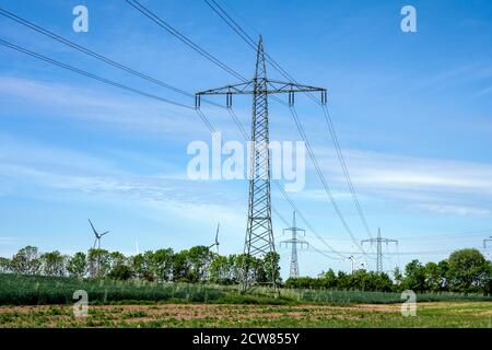 Electricity pylons and power lines seen in Germany Stock Photo