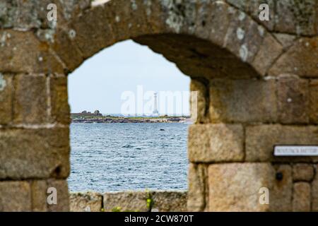 Bishop Rock Lighthouse seen through an archway at Woolpack Point Battery, The Garrison, St Mary's, Isles of Scilly Stock Photo