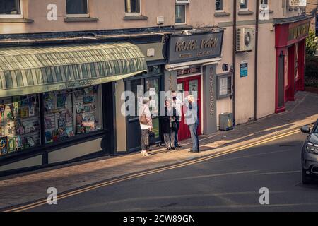 Everyday life. Small group of people chatting on the street. Greystones. Ireland. Stock Photo