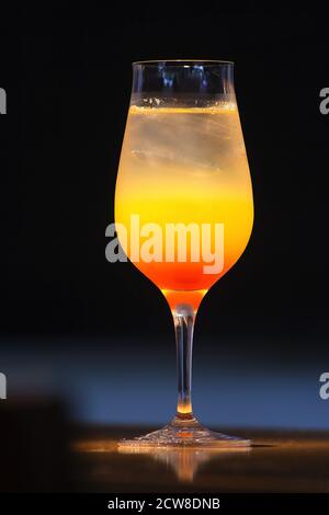 Tequila Sunrise, classic drink with tequila, orange juice and currant Stock Photo