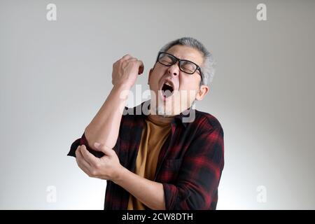 The Asian man standing on the white background. Stock Photo