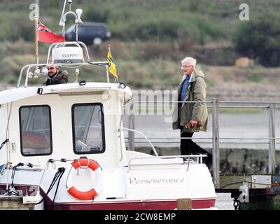 Queenborough, Kent, UK. 28th September, 2020. Paul O'Grady was spotted in Queenborough Harbour this afternoon, after returning from a journey out to sea on the X-Pilot tug filming a feature on the Red & Shivering Sands Forts out in the Thames Estuary for ITV. Credit: James Bell/Alamy Live News Stock Photo