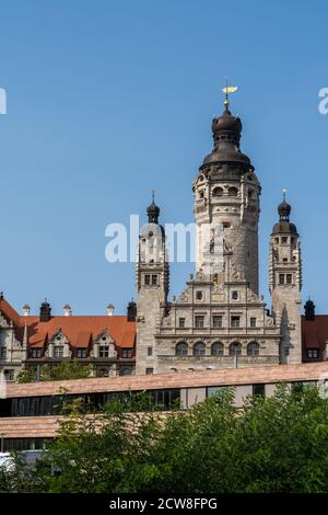 Leipzig, Saxony / Germany - 12 September 2020: the old city hall building in Leipzig with the church of St. Trinitatis in the foreground Stock Photo