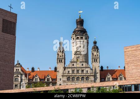 Leipzig, Saxony / Germany - 12 September 2020: the old city hall building in Leipzig with the church of St. Trinitatis in the foreground Stock Photo