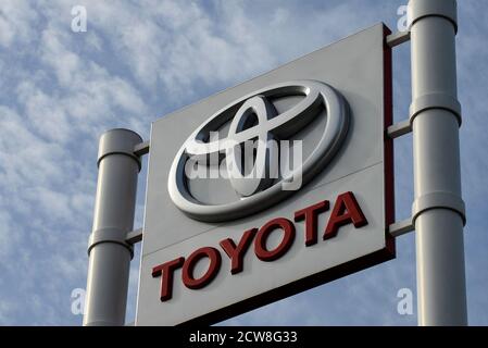 Toyota motor corporation logo seen on one of their car dealerships showrooms. Stock Photo