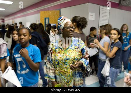 Pflugerville, TX  June 2, 2008: African-American world geography teacher of Nigerian descent in school hallway during annual Park Crest Middle School's annual 'Diversity Day' featuring ethnic food, skits, poetry readings and music. ©Bob Daemmrich Stock Photo