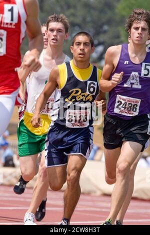 Austin, TX May 10, 2008: Hispanic, Anglo boys head towards the finish of the 1600-meter run at the Texas high school state championship track meet at the University of Texas at Austin. ©Bob Daemmrich Stock Photo