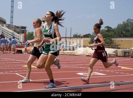 Austin, TX May 10, 2008: Anglo and Hispanic girls compete in the 1600-meter run at the Texas high school state championship track meet at the University of Texas at Austin. ©Bob Daemmrich Stock Photo
