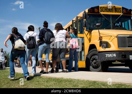 Pflugerville, TX  June 2, 2008: Middle school students leaving on buses at Park Crest Middle School in an Austin suburb.  ©Bob Daemmrich/ Stock Photo