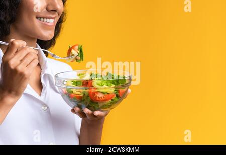 Healthy Eating. Young Woman Holding Bowl With Fresh Vegetable Salad, Cropped Image Stock Photo
