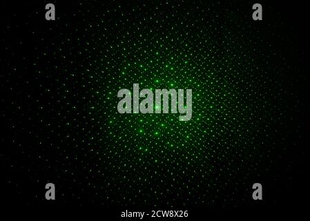 Abstract lines of green laser light on black background Stock Photo