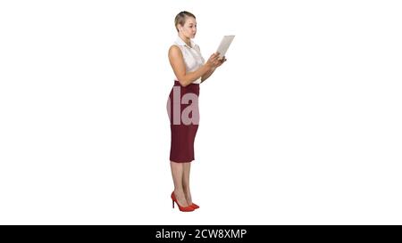 Beautiful modern woman using digital tablet on white background. Stock Photo