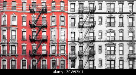 Old brick apartment buildings with fire escapes in the East Village of New York City in red black and white Stock Photo