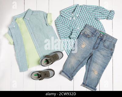 Men's casual outfits for man clothing set with t-shirt, gray shoes, shorts isolated on a white background, top view Stock Photo