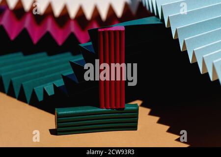 Modern multicolored composition of bars of clay and fans of cardboard. Stylish geometric concept. Stock Photo