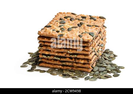 Stack  of cheese and pumpkin seed organic crispbread isolated on white Stock Photo