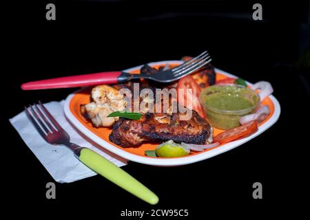 Indian style roasted chicken or tandoori chicken. Indian non vegetarian foods. Stock Photo