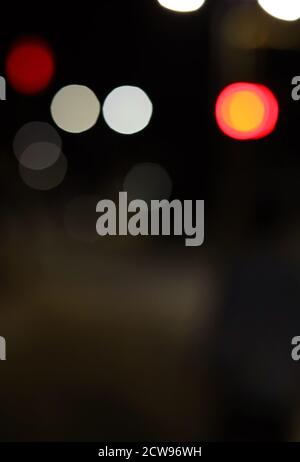 abstract background of blurred warm lights with cool blue and purple background with bokeh effects Stock Photo
