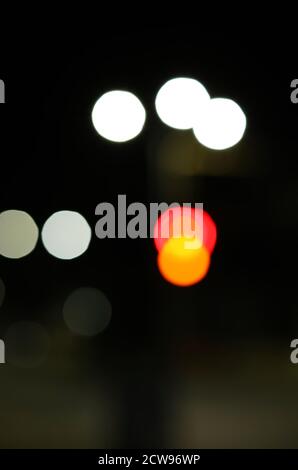 abstract background of blurred warm lights with cool blue and purple background with bokeh effects Stock Photo