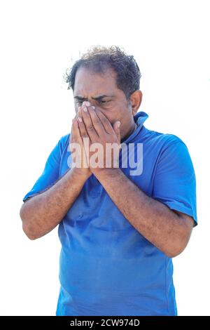 Asian male coughing, sneezing or having a runny nose and fever. Asian men exposed to corona virus Stock Photo