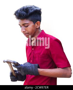 Young mechanics hand holding cutter with hammer, isolated in white backgrounds Stock Photo