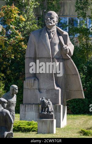 Large Lenin statue made in 1971 by Lev Kerbel dwarfs the rest of sculptures and dominates the landscape at Museum of Socialist Art in Sofia Bulgaria Stock Photo