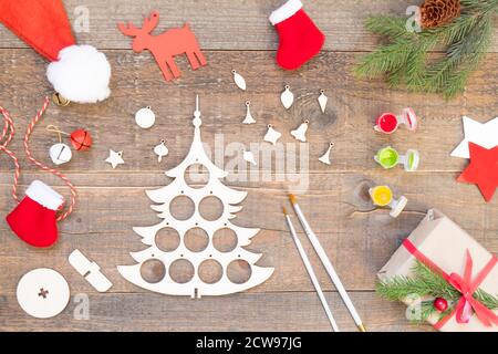 How to make a Christmas tree from a wooden blank. Children art project. DIY concept. Step by step photo instruction. Step 1 materials and tools. Stock Photo